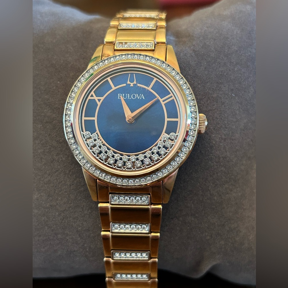 Bulova rose gold tone watch with blue face